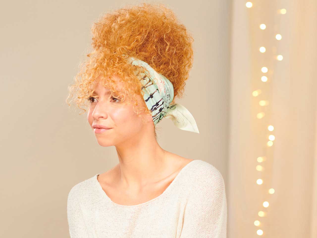 Updo in a scarf: a style for curly hair